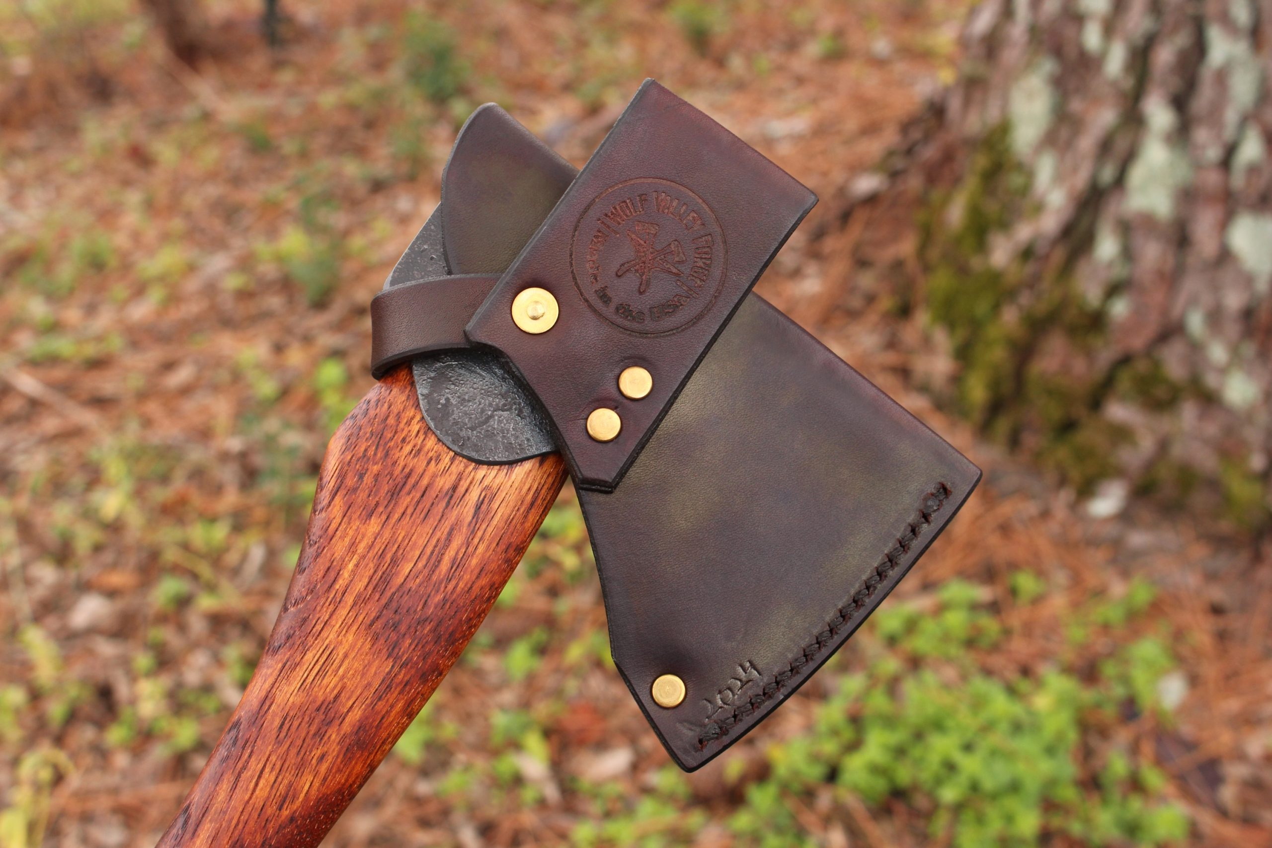 handmade, usa made, usa made axe, hatchet, chopping, wood chopping, outdoor, outdoorsman, survival, backwoodsman, hickory, axe made in america, axes made in the usa, ike bullington, wolf valley forge, valley forge, pack axe, back packing, camping, trail axe, hunting axe, trappers axe, camp axe, bush axe, belt axe, pack axe, leather shoulder rig, chopping axe, leather axe carrier, shoulder sling for axe, carpenter's axe, Wolf Valley Forge, Wolf Valley Forge axe release, Axe Wax, haversack, go back, man purse, man bag, canvas bag, reenactor, reenacting, Trekker Axe, Axe Life