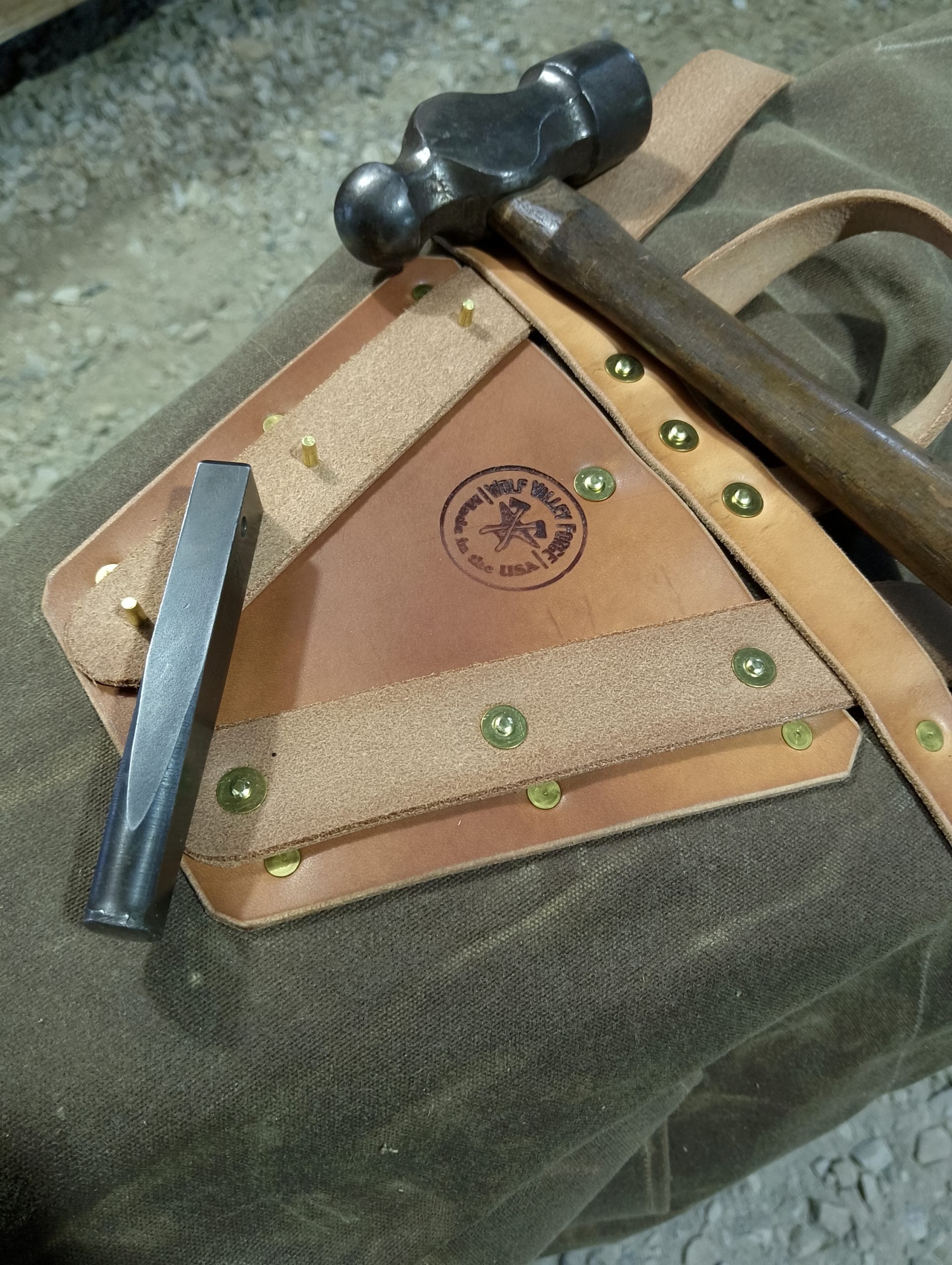 handmade, usa made, usa made axe, hatchet, chopping, wood chopping, outdoor, outdoorsman, survival, backwoodsman, hickory, axe made in america, axes made in the usa, ike bullington, wolf valley forge, valley forge, pack axe, back packing, camping, trail axe, hunting axe, trappers axe, camp axe, bush axe, belt axe, pack axe, leather shoulder rig, chopping axe, leather axe carrier, shoulder sling for axe, carpenter's axe, Wolf Valley Forge, Wolf Valley Forge axe release, Axe Wax, haversack, go back, man purse, man bag, canvas bag, reenactor, reenacting, Trekker Axe, canvas pack, backpacking, long hauler, sipsey wilderness area