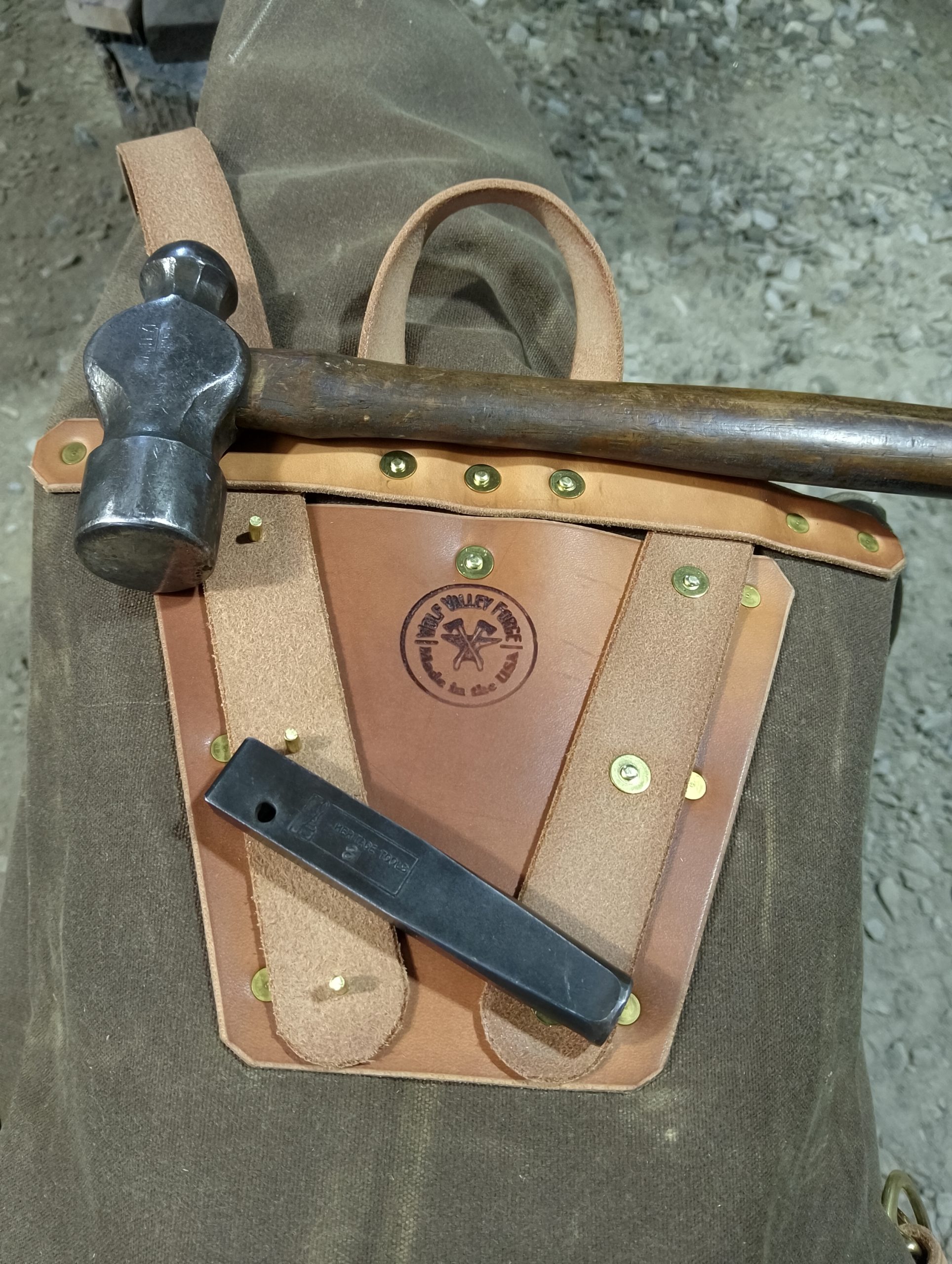 handmade, usa made, usa made axe, hatchet, chopping, wood chopping, outdoor, outdoorsman, survival, backwoodsman, hickory, axe made in america, axes made in the usa, ike bullington, wolf valley forge, valley forge, pack axe, back packing, camping, trail axe, hunting axe, trappers axe, camp axe, bush axe, belt axe, pack axe, leather shoulder rig, chopping axe, leather axe carrier, shoulder sling for axe, carpenter's axe, Wolf Valley Forge, Wolf Valley Forge axe release, Axe Wax, haversack, go back, man purse, man bag, canvas bag, reenactor, reenacting, Trekker Axe, canvas pack, backpacking, long hauler, sipsey wilderness area