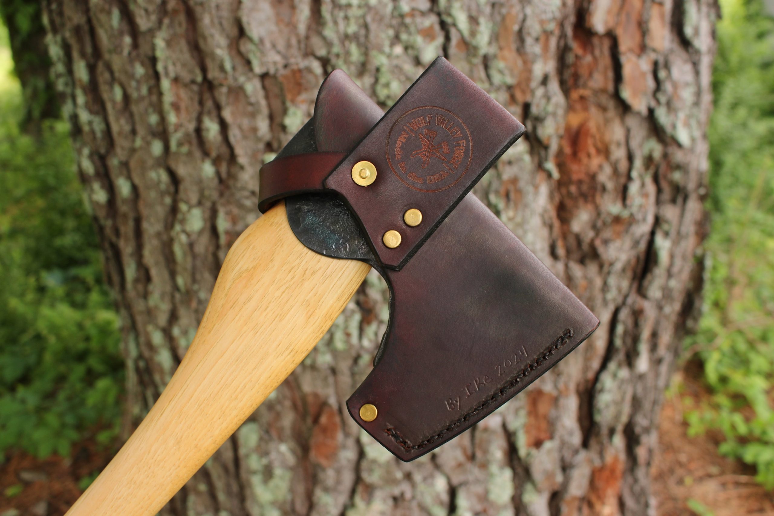 handmade, usa made, usa made axe, hatchet, chopping, wood chopping, outdoor, outdoorsman, survival, backwoodsman, hickory, axe made in america, axes made in the usa, ike bullington, wolf valley forge, valley forge, pack axe, back packing, camping, trail axe, hunting axe, trappers axe, camp axe, bush axe, belt axe, pack axe, leather shoulder rig, chopping axe, leather axe carrier, shoulder sling for axe, carpenter's axe, Wolf Valley Forge, Wolf Valley Forge axe release, Axe Wax, haversack, go back, man purse, man bag, canvas bag, reenactor, reenacting