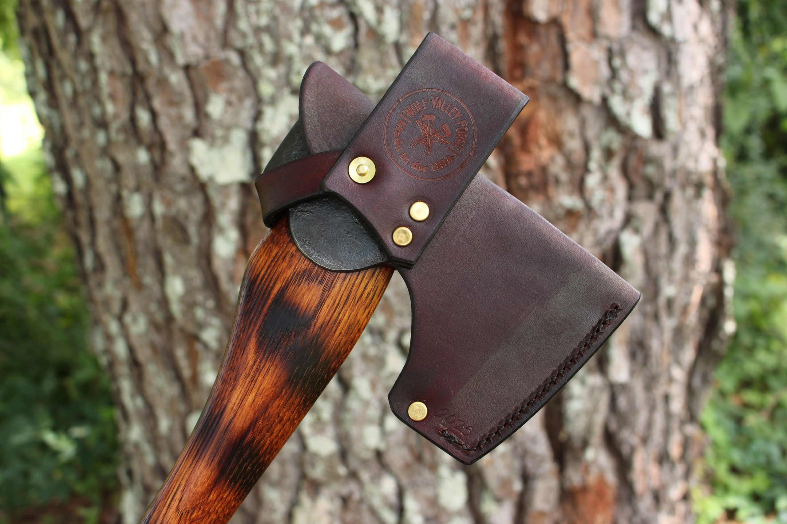 handmade, usa made, usa made axe, hatchet, chopping, wood chopping, outdoor, outdoorsman, survival, backwoodsman, hickory, axe made in america, axes made in the usa, ike bullington, wolf valley forge, valley forge, pack axe, back packing, camping, trail axe, hunting axe, trappers axe, camp axe, bush axe, belt axe, pack axe, leather shoulder rig, chopping axe, leather axe carrier, shoulder sling for axe, carpenter's axe, Wolf Valley Forge, Wolf Valley Forge axe release, Axe Wax, haversack, go back, man purse, man bag, canvas bag, reenactor, reenacting