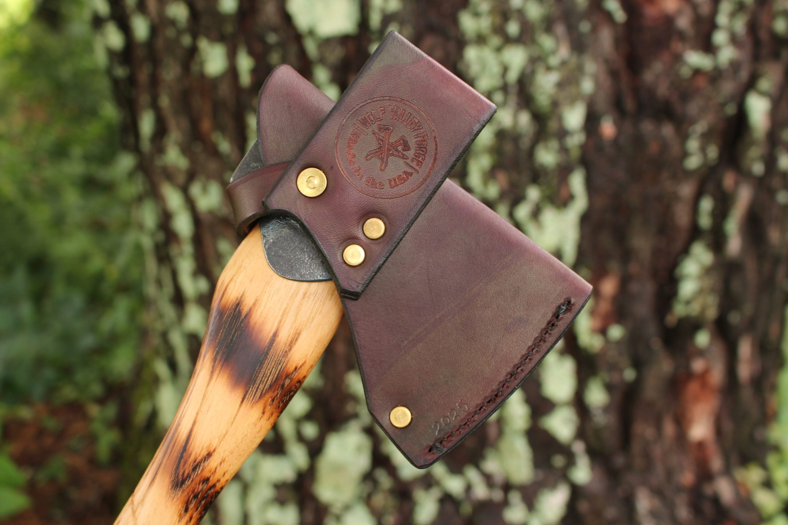 handmade, usa made, usa made axe, hatchet, chopping, wood chopping, outdoor, outdoorsman, survival, backwoodsman, hickory, axe made in america, axes made in the usa, ike bullington, wolf valley forge, valley forge, pack axe, back packing, camping, trail axe, hunting axe, trappers axe, camp axe, bush axe, belt axe, pack axe, leather shoulder rig, chopping axe, leather axe carrier, shoulder sling for axe, carpenter's axe, Wolf Valley Forge, Wolf Valley Forge axe release, Axe Wax, haversack, go bag, man purse, man bag, canvas bag, reenactor, reenacting, Trekker Axe, Axe Life